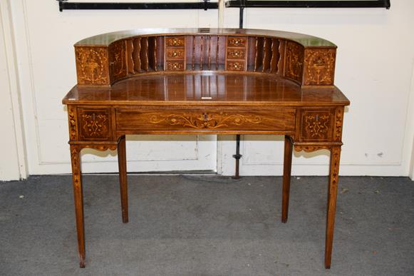 An American mahogany Carlton House style desk with marquetry inlay, with fitted superstructure and