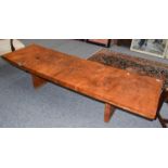 A modern rustic burr elm rectangular coffee table of slab form, raised on matching supports, 193cm