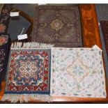 Ottoman floral embroidery, 43cm by 41cm, and two Indian mats, 40cm by 37cm and 34cm by 32cm (3)