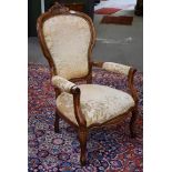 A 20th century carved walnut and upholstered chair