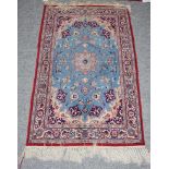 Isfahan rug, the sky blue field of vines around a flower head medallion enclosed by meandering