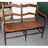 An early 20th century oak bench, 108cm by 51cm by 93cm