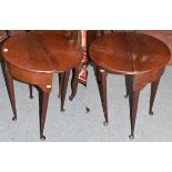 A pair of 19th century mahogany foldover demi lune occasional tables of small proportions, raised on