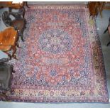 Tabriz carpet, the terracotta field of vines around an indigo and pale lemon medallion framed by