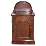 A Victorian Walnut Miniature Cabinet, with arched cresting over door with arched panel enclosing two