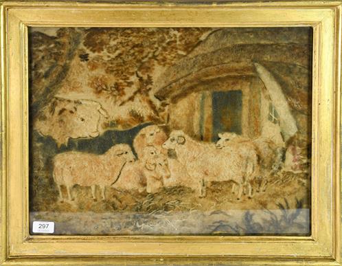 An Early 19th Century Raised Woolwork Picture, pastoral scene with a bull and sheep before a byre,