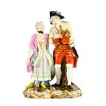 A Meissen Porcelain Figure Group, circa 1900, as a soldier and lady wearing 18th century costume arm