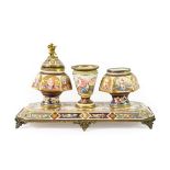 An Austrian Enamel Inkstand, circa 1900, with central conical urn flaked by two inkpots and a cover,