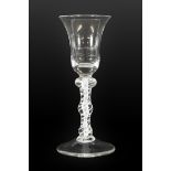 A Wine Glass, circa 1765, the bell shaped bowl on a triple knopped opaque twist stem, 17cm high