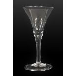 A Wine Glass, circa 1750, the funnel bowl on plain stem with air tear and folded foot, 14.5cm