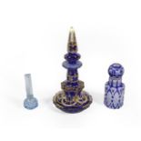 Three Glass Scent-Bottles, comprising: a gilt-heightened blue glass example, 19.5cm high; a cased