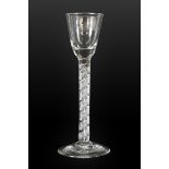 A Cordial Glass, circa 1760, the rounded funnel bowl on a mercurial twist stem, 17.5cm high