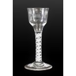 A Wine Glass, circa 1750, the ogee bowl on an opaque twist stem and circular foot, 15cm high. Wear