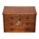 A Victorian Oak and Parquetry Chest, of two short and two long drawers with turned handles, on bun