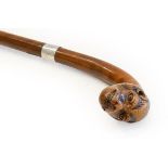 A George V Rootwood Walking Stick, the handle carved as the head of a monkey, with plain silver