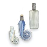 Two Glass Scent-Bottles, each with rolled end, one with silver-mounted neck and carved flower