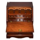 A Victorian Satinwood Banded Mahogany Miniature Bureau, the hinged fall with quarter paterae