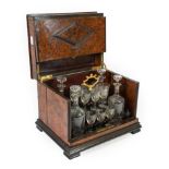 A French Amboyna Travelling Liqueur Set, mid 19th century, of rectangular form with applied