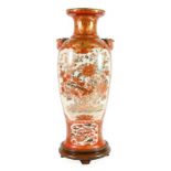 A Kutani Porcelain Vase, circa 1900, of baluster form with birds' mask handles, typically painted in