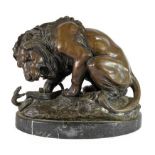 After Antoine Louis Barye (1795-1875): A Patinated Bronze Model of Lion au Serpent, on a marble