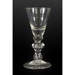 A Wine Glass, circa 1720, the conical bowl with solid base and basal knop on a angular baluster stem