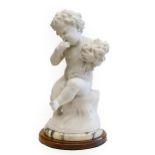 Italian School (late 19th/early 20th century): A White Marble Figure of a Cherub, seated on a