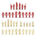 A Cantonese Stained and Natural Ivory Chess Set, late 19th century, carved as Chinese figures on