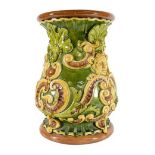 A Majolica Garden Seat, circa 1890, in Burmantofts style, of baluster form, moulded with masks,