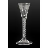 A Wine Glass, circa 1750, the drawn trumpet bowl engraved with fruiting vine over a mercurial