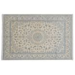 Nain Carpet Central Iran, circa 1970 The cream field of scrolling vines around a medallion framed by