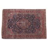 Kashan Carpet, Central Iran Central Iran, circa 1930 The deep indigo field of vines around a