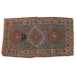 Kazak Rug Central Caucasus, circa 1880 The pale indigo field with three latch hook medallions