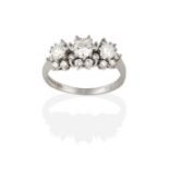 An 18 Carat White Gold Diamond Triple Cluster Ring, graduated round brilliant cut diamonds within