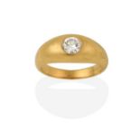 A Diamond Solitaire Ring, the round brilliant cut diamond inset within a yellow plain polished