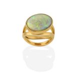 An 18 Carat Gold Opal Ring, the oval cabochon opal in a yellow rubbed over setting, to a double