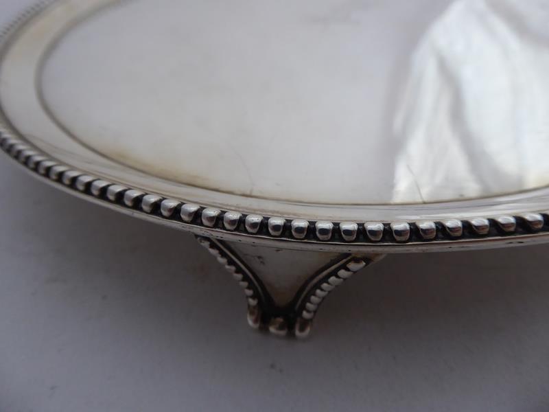 A George III Silver Waiter, by Elizabeth Jones, London, 1786, circular and with beaded border, on - Image 7 of 7