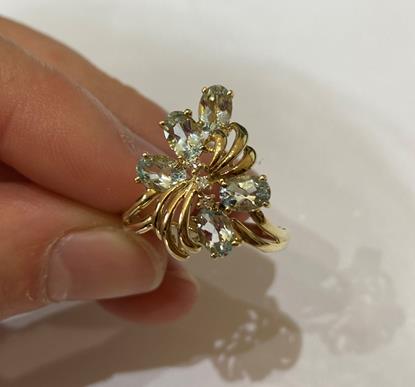 A 9 Carat Gold Aquamarine Ring, the floral motif set throughout with oval cut aquamarines and - Image 4 of 8