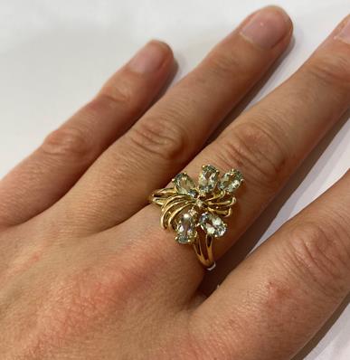 A 9 Carat Gold Aquamarine Ring, the floral motif set throughout with oval cut aquamarines and - Image 5 of 8