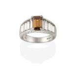 An 18 Carat White Gold Diamond Ring, by David Morris, an emerald-cut brown diamond flanked by