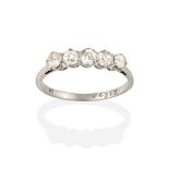 A Diamond Five Stone Ring, the old cut diamonds in white claw settings, to a tapered shoulder