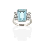 An Aquamarine and Diamond Ring, the emerald-cut aquamarine flanked by baguette cut and eight-cut