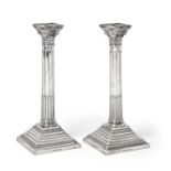 A Pair of George V Silver Candlesticks, by Aaron Taitelbaum, London, 1931, each on stepped square