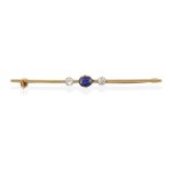 A Sapphire and Diamond Bar Brooch, an oval cut sapphire in a yellow claw setting, flanked by round