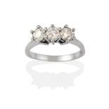 An 18 Carat White Gold Diamond Three Stone Ring, the round brilliant cut diamonds in claw