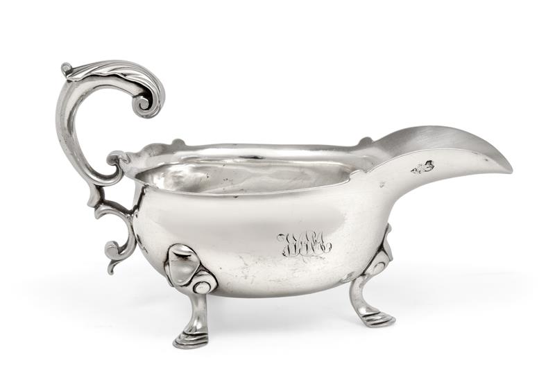 A George II Silver Sauceboat, by John Barbe, London, 1745, oval and on three scroll capped pad feet,