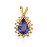 A Tanzanite and Diamond Cluster Pendant, the pear shaped tanzanite in a yellow rubbed over