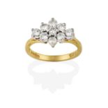 An 18 Carat Gold Diamond Cluster Ring, the round brilliant cut diamonds in white claw settings, to a