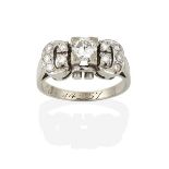 A Diamond Cluster Ring, the buckle motif set throughout with round brilliant cut diamonds, in