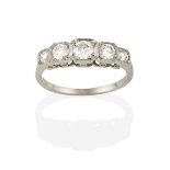 A Diamond Five Stone Ring, the graduated round brilliant cut diamonds in white square millegrain