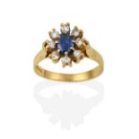 An 18 Carat Gold Sapphire and Diamond Cluster Ring, the oval cut sapphire, in white claw settings,